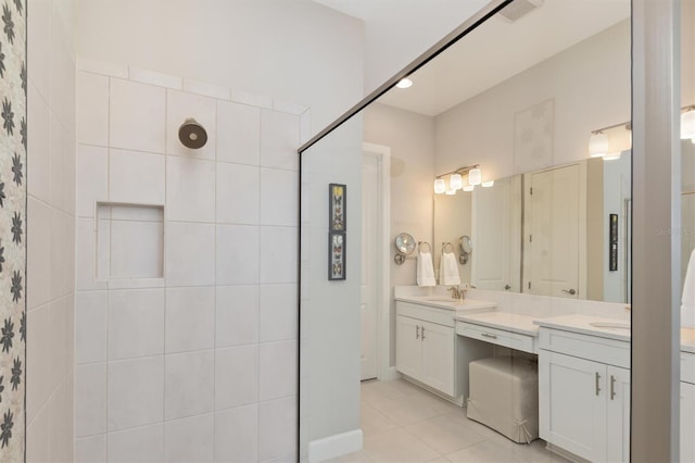 bathroom with tile patterned flooring and vanity