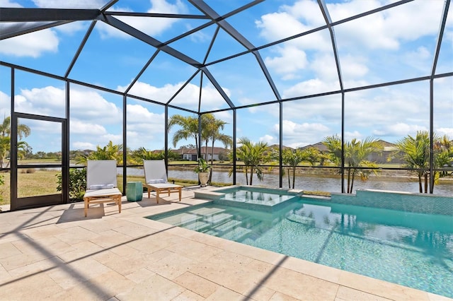 view of pool with an in ground hot tub, a water view, glass enclosure, and a patio area