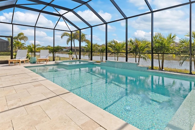 view of pool with an in ground hot tub, a water view, a patio, and glass enclosure