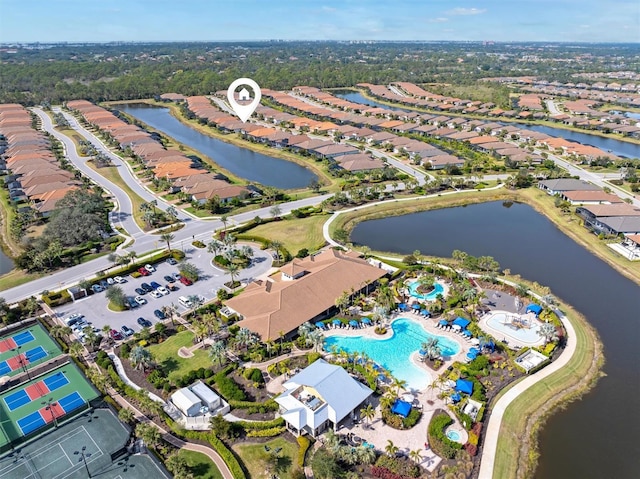 birds eye view of property with a water view