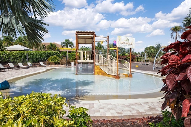 view of pool featuring a playground