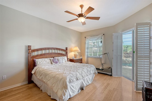 bedroom featuring ceiling fan, access to exterior, and light hardwood / wood-style floors