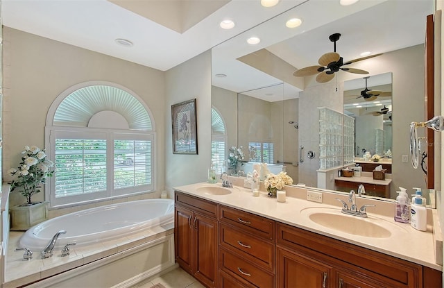 bathroom with vanity, tile patterned floors, plus walk in shower, and ceiling fan