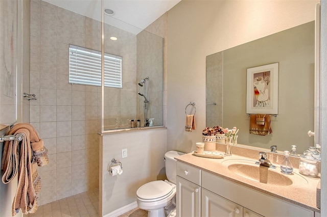 full bathroom with toilet, a walk in shower, and vanity