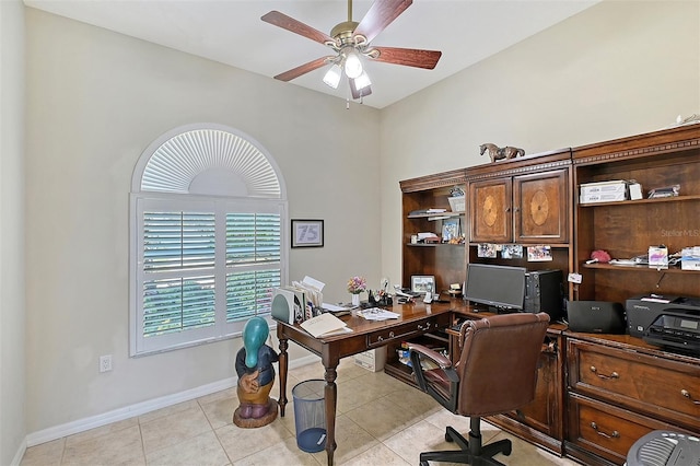 office area featuring light tile patterned floors, ceiling fan, and baseboards