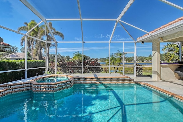 view of swimming pool with a patio, a lanai, and a pool with connected hot tub