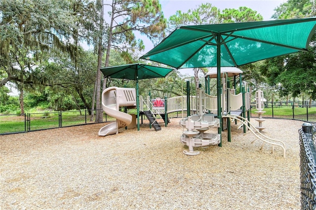 communal playground featuring fence