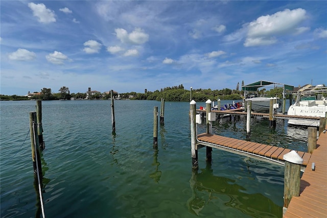 dock area with a water view and boat lift