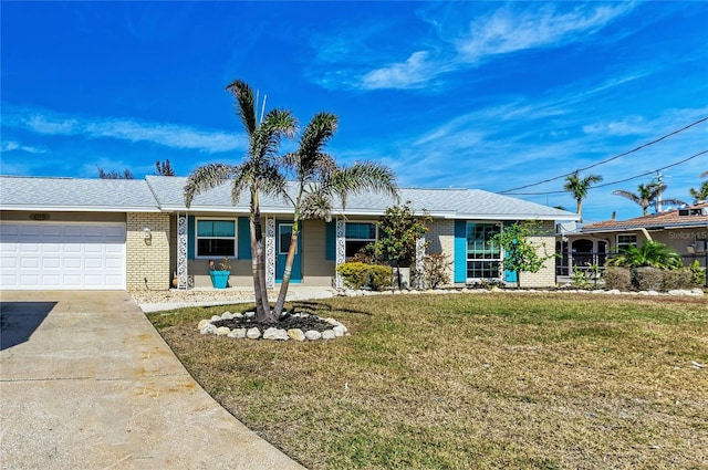 ranch-style house featuring a front yard and a garage