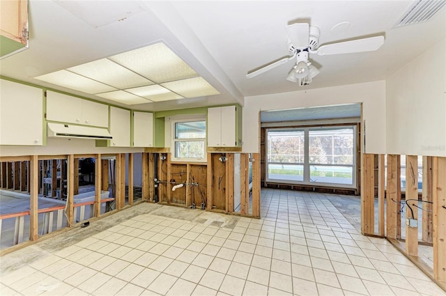 interior space with ceiling fan and light tile patterned floors