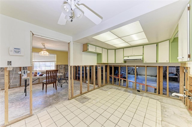 interior space featuring ceiling fan