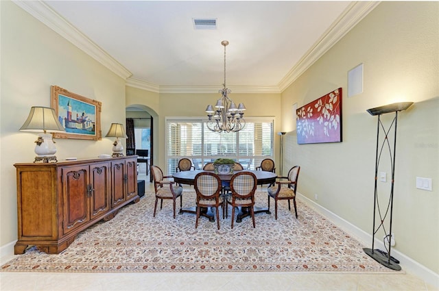 tiled dining room with ornamental molding and a notable chandelier