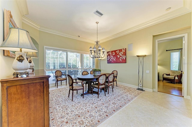 tiled dining area with a notable chandelier, a wealth of natural light, and ornamental molding