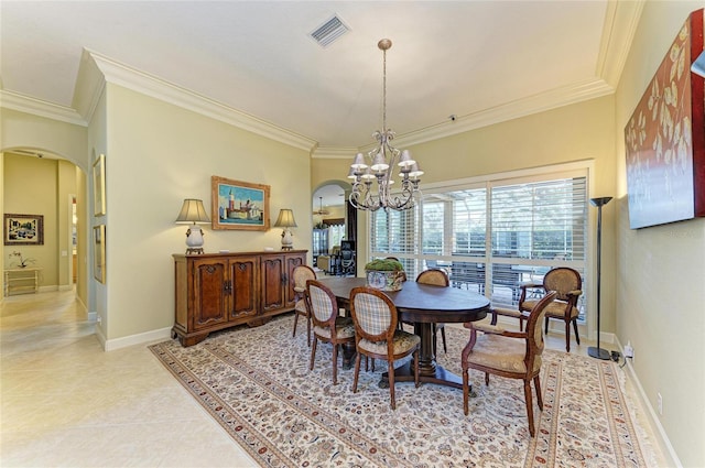 tiled dining area with ornamental molding and a chandelier