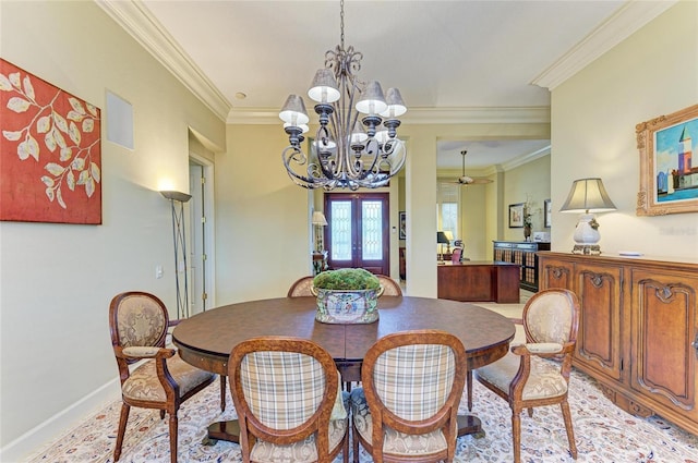 dining area featuring french doors, ornamental molding, and ceiling fan with notable chandelier