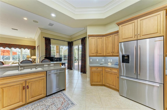 kitchen featuring light tile patterned flooring, ornamental molding, stainless steel appliances, and sink