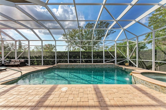 view of swimming pool with an in ground hot tub, pool water feature, a lanai, and a patio