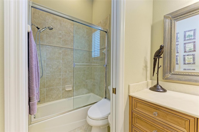 full bathroom with shower / bath combination with glass door, vanity, and toilet