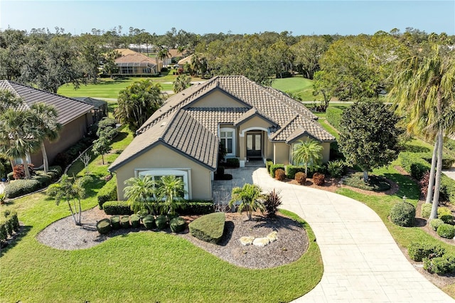 mediterranean / spanish-style house with a front lawn