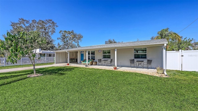 single story home with a patio area and a front lawn