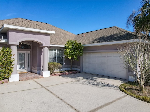 ranch-style house featuring a garage