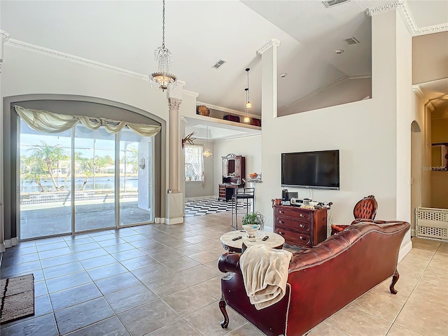 living room featuring lofted ceiling, ornamental molding, and light tile patterned flooring