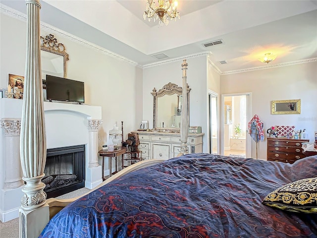 bedroom with connected bathroom, crown molding, and a notable chandelier