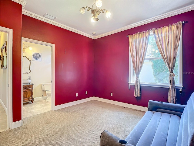 sitting room with crown molding, a chandelier, and light carpet