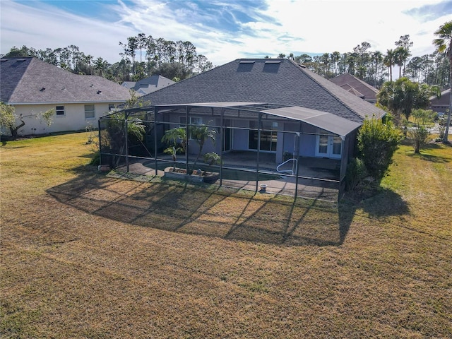 back of house with a yard, a lanai, and a patio