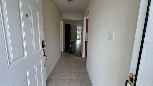 hallway featuring light tile patterned flooring