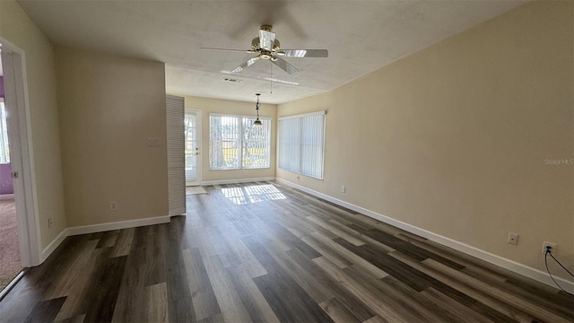 unfurnished room featuring dark hardwood / wood-style flooring and ceiling fan