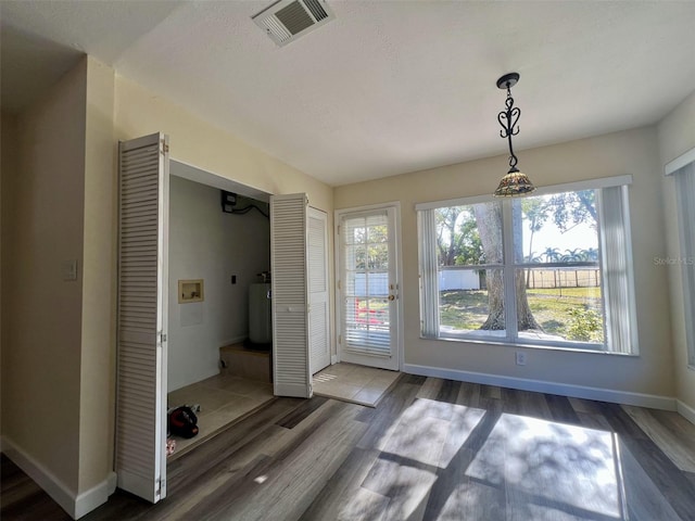 entryway with dark wood-type flooring