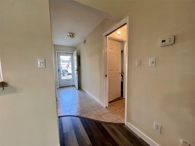 hallway with light tile patterned floors