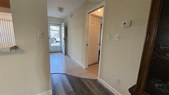 hall with light tile patterned flooring