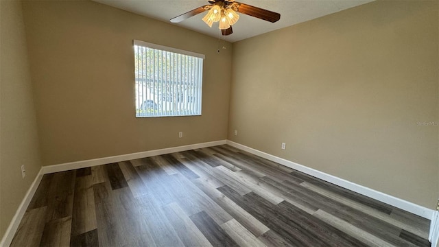 spare room featuring hardwood / wood-style floors and ceiling fan