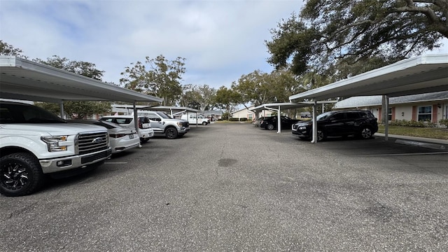 view of parking / parking lot featuring a carport