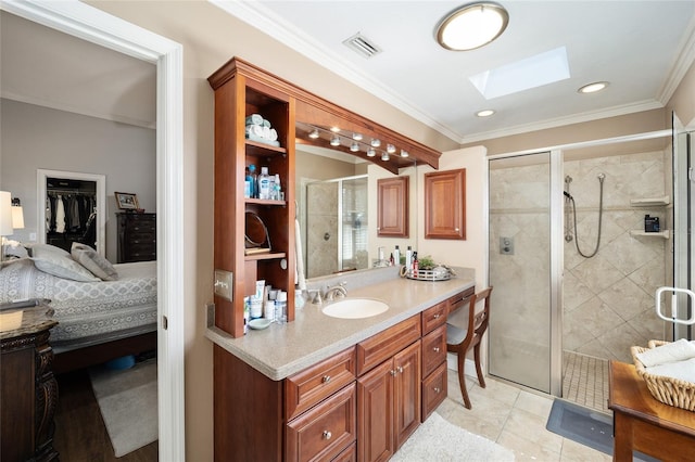 bathroom with a skylight, crown molding, visible vents, a stall shower, and vanity