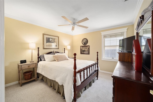 bedroom featuring baseboards, ornamental molding, a ceiling fan, and light colored carpet