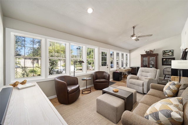 interior space with lofted ceiling and a ceiling fan