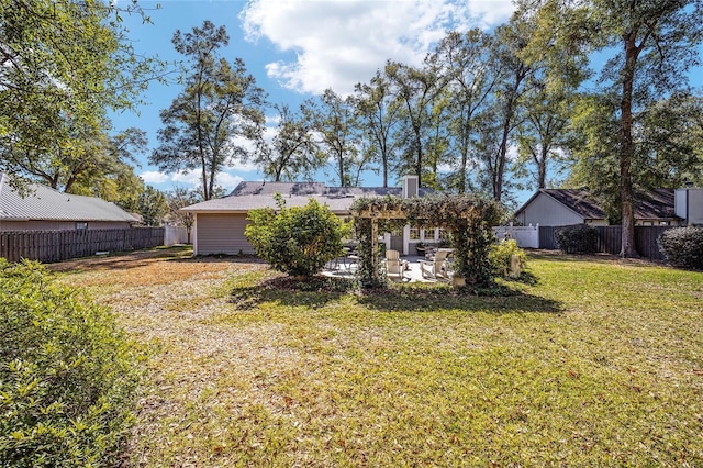 back of house featuring a fenced backyard, a lawn, and a patio