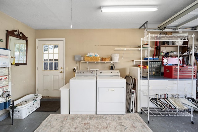 laundry room featuring laundry area, gas water heater, and separate washer and dryer