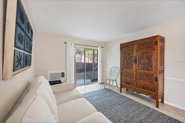 living room featuring light tile patterned floors and a wall mounted air conditioner