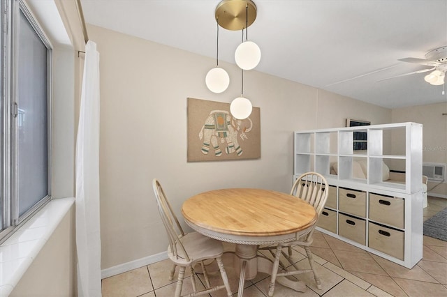 dining room with ceiling fan and light tile patterned floors