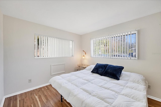 bedroom with hardwood / wood-style floors