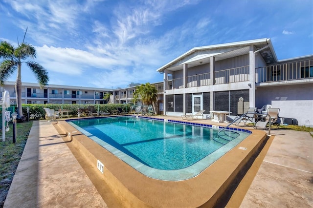 view of swimming pool with a patio area