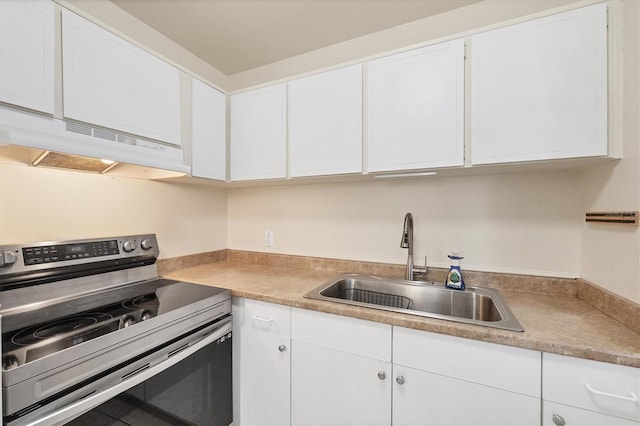 kitchen with white cabinetry, sink, and stainless steel electric stove