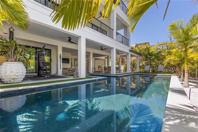 view of pool featuring ceiling fan and a patio area