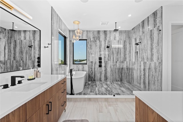 bathroom featuring vanity, tile walls, and separate shower and tub