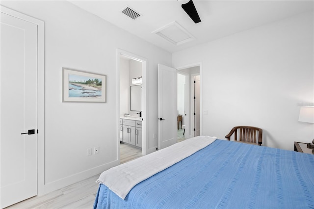 bedroom with connected bathroom, light hardwood / wood-style flooring, and ceiling fan