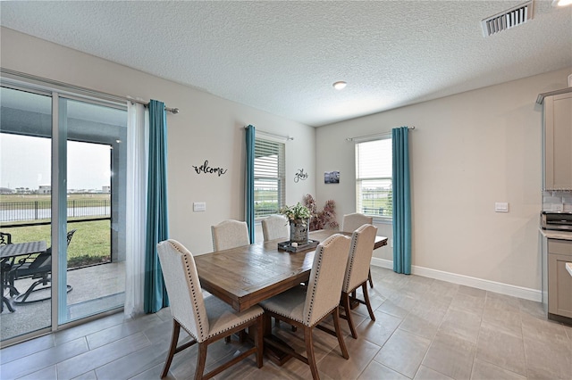 dining area with a textured ceiling